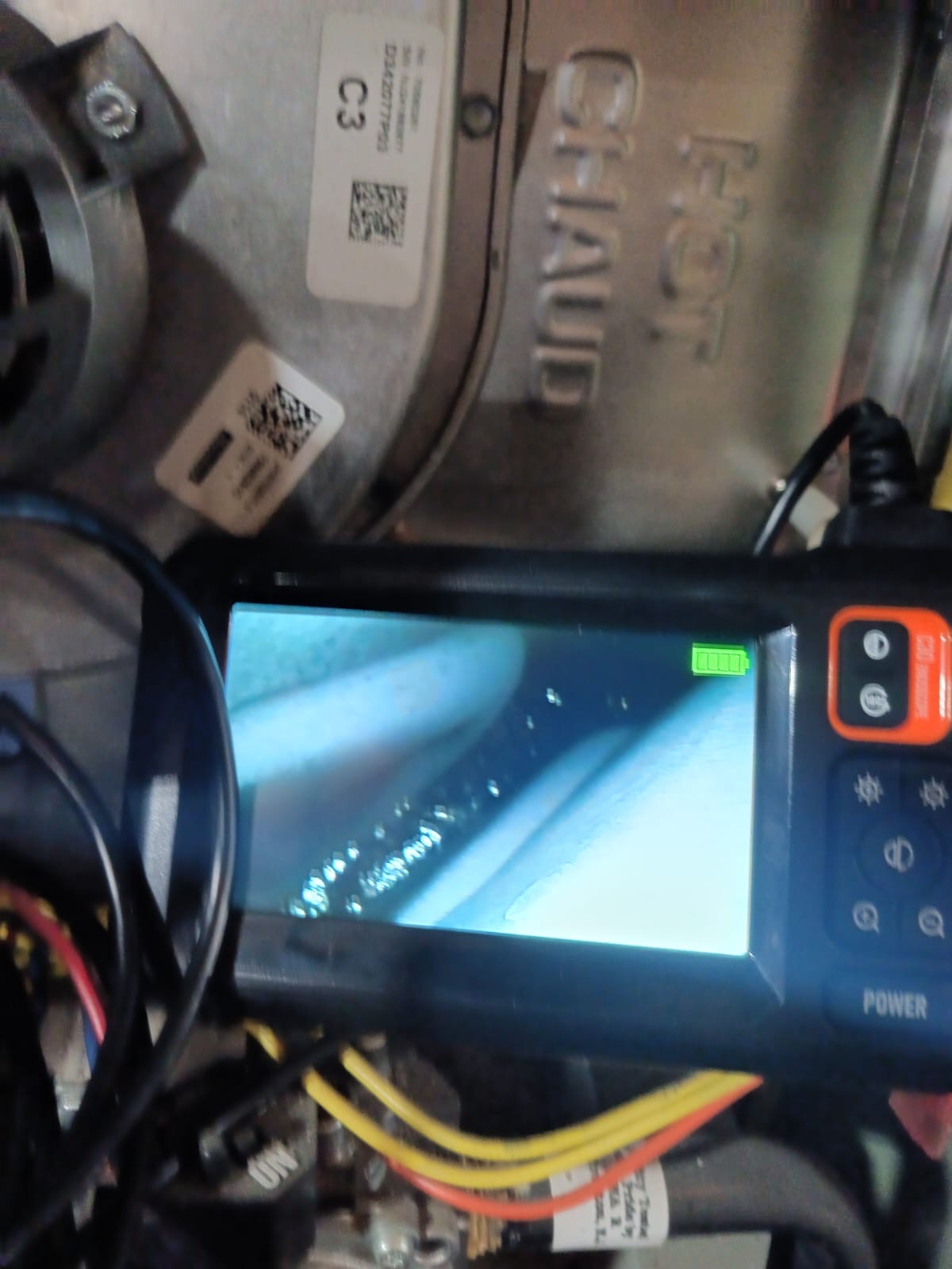 Borescope inspection camera being used on a heat exchanger